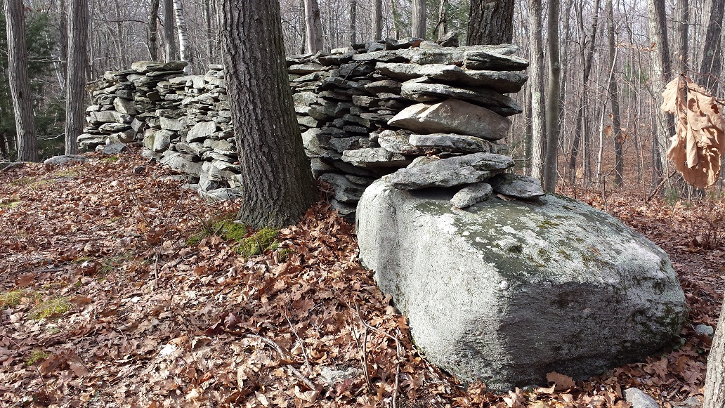 various lithic features in the northeast, including rock piles, stone rows, stone circles, chambers, standing stones, propped boulders, mounds, petroglyphs, and pictographs