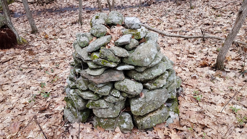 various lithic features in the northeast, including rock piles, stone rows, stone circles, chambers, standing stones, propped boulders, mounds, petroglyphs, and pictographs