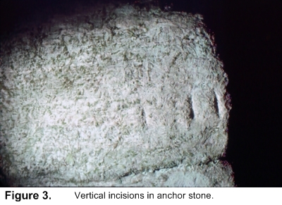 Vertical incisions in anchor stone.