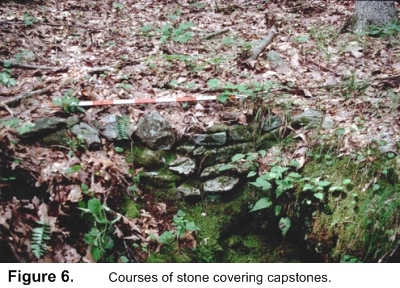 Courses of stone covering capstones.
